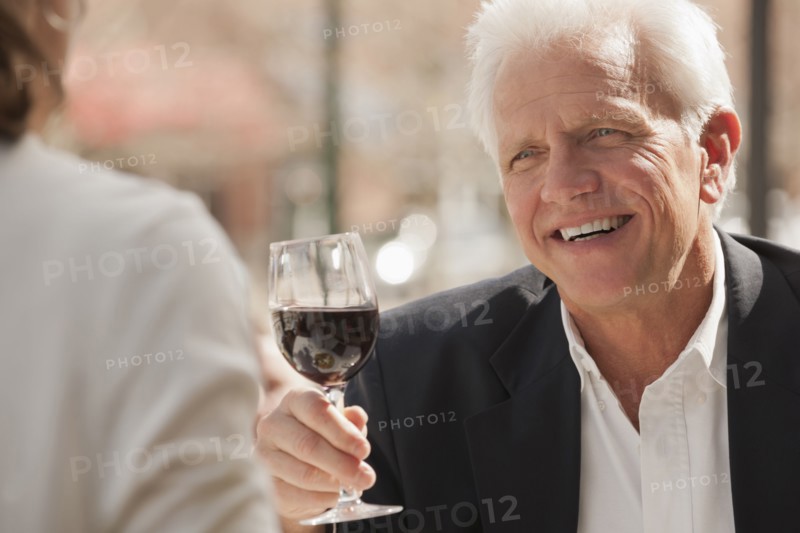 Caucasian couple drinking wine