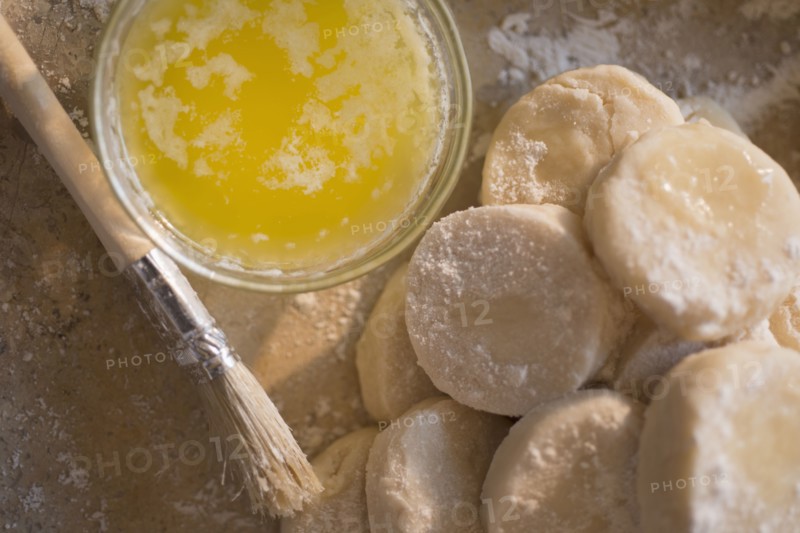 Close up of biscuit rounds and butter