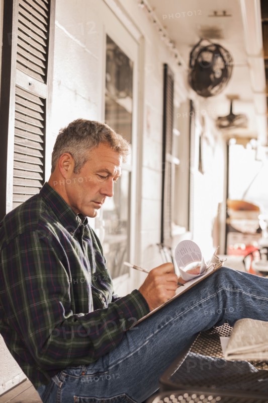 Caucasian businessman working on patio