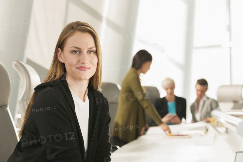 Businesswoman smiling in meeting