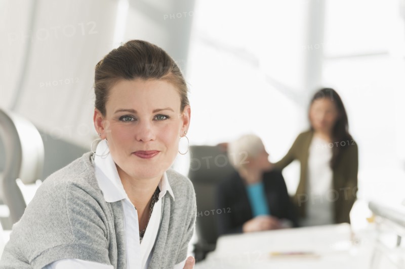 Businesswoman smiling in meeting