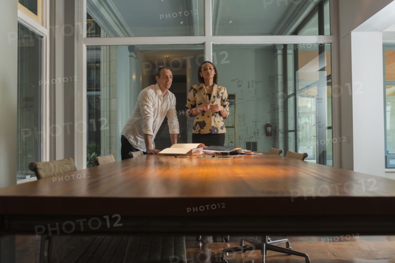 Business people standing in conference room