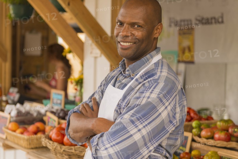 African American vendor smiling at farmers market