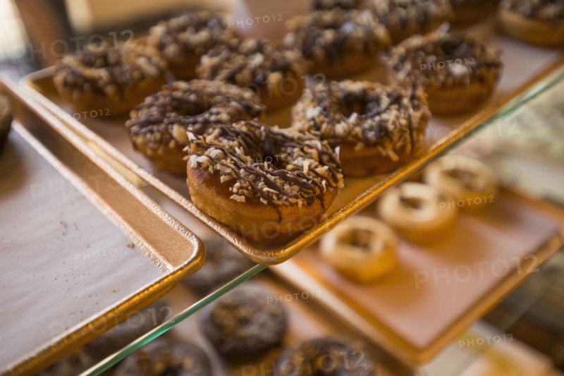 Close up of donuts for sale in bakery