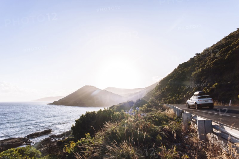 Car driving on coastal road