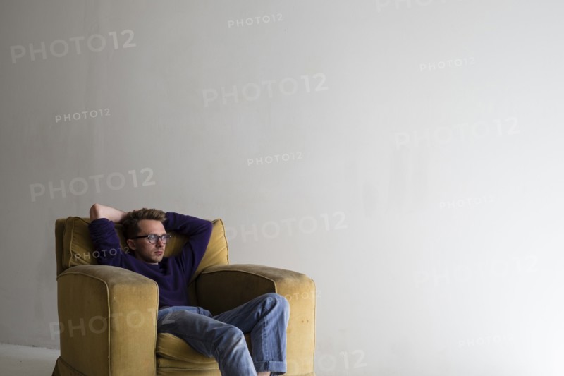 Caucasian man sitting in armchair
