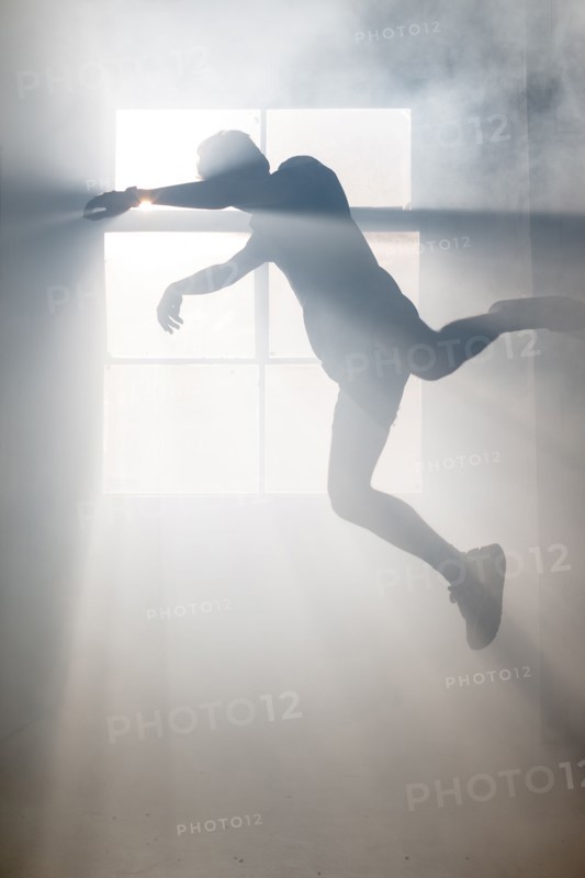 Shadow of Caucasian man at window