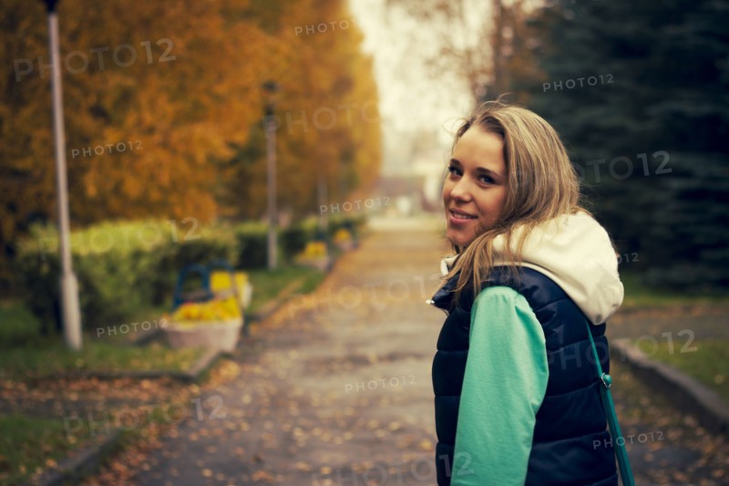 Caucasian woman walking on neighborhood street
