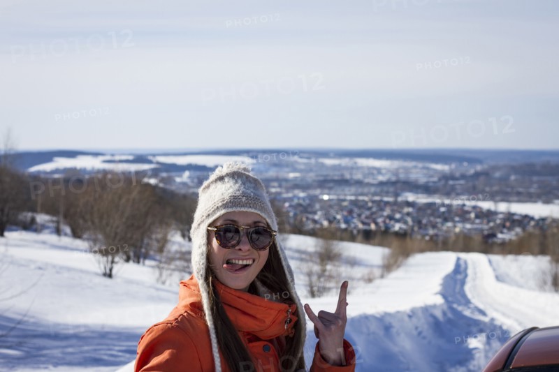 Caucasian woman gesturing on snowy road