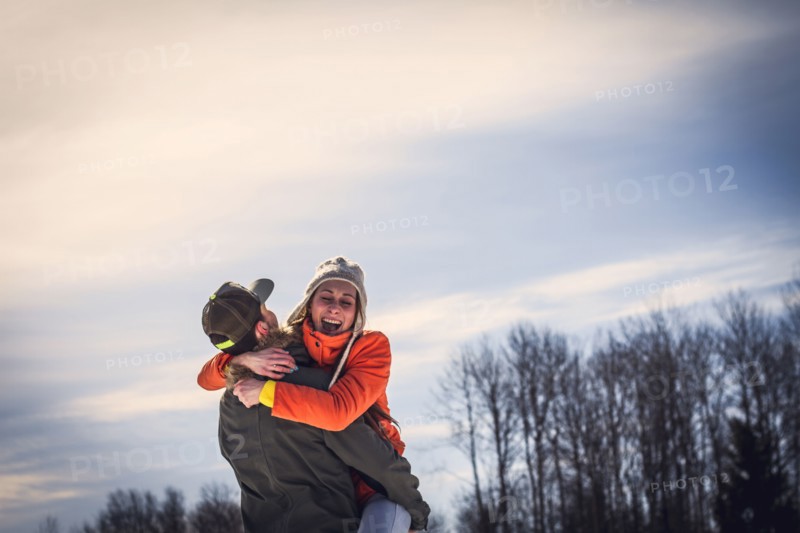 Caucasian couple hugging outdoors