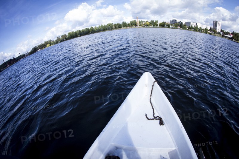 Rowboat floating in lake