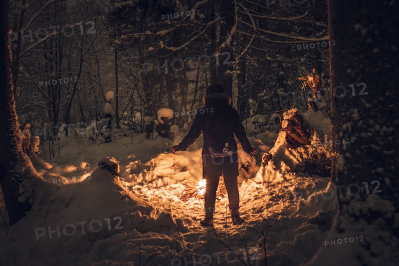 Caucasian hiker wearing headlamp exploring forest