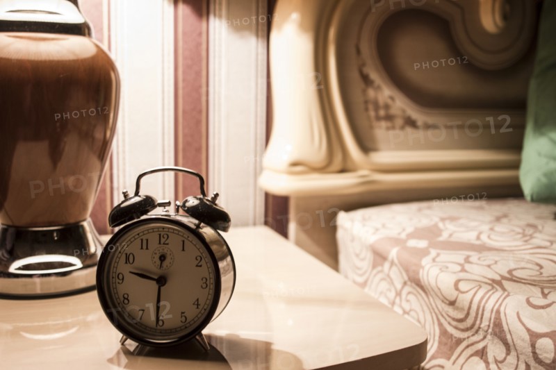 Alarm clock on bedside table