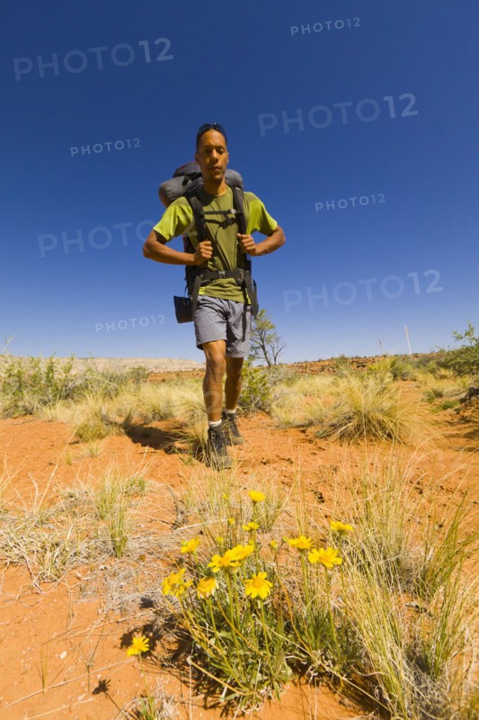 Black man hiking in desert