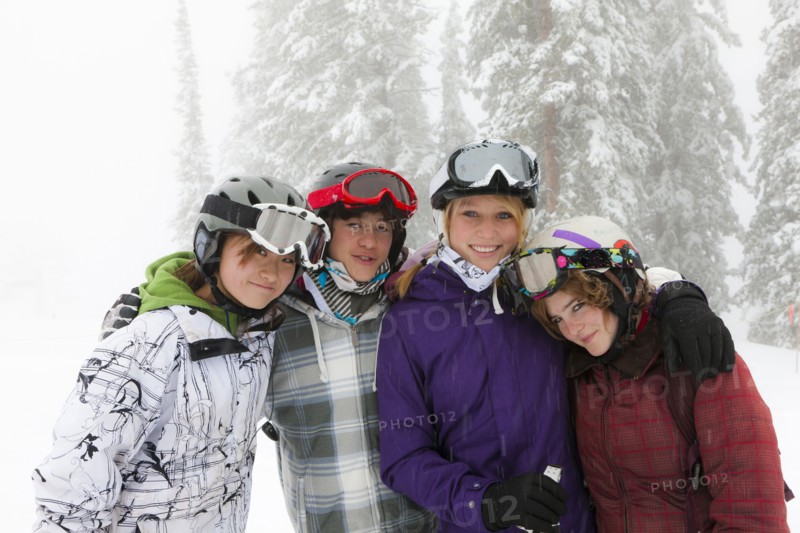 Skiers standing in snow