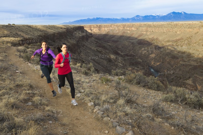 Hispanic runners training in remote area