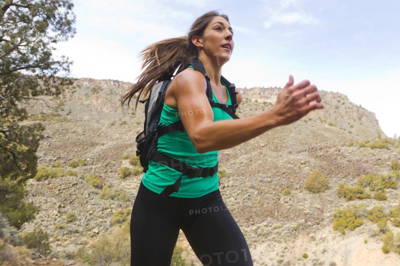 Hispanic runner training in remote area