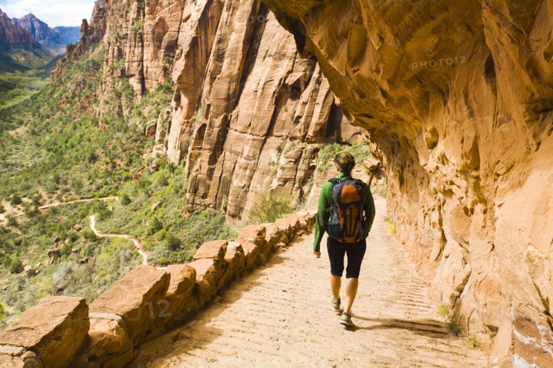 Persian woman hiking on canyon path