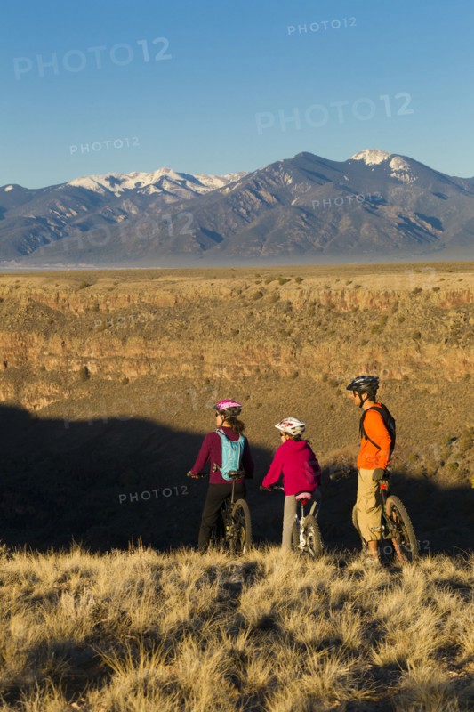 Family mountain biking together