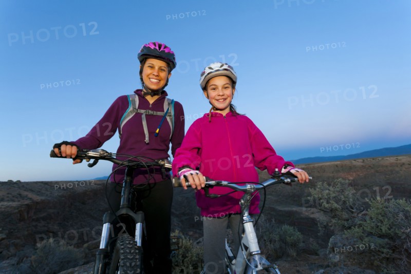 Sisters mountain biking together