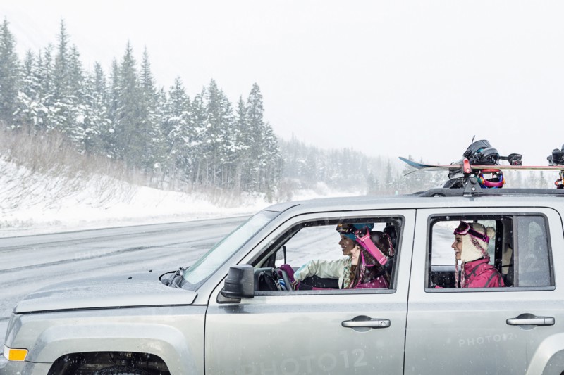 Friends driving in car in winter