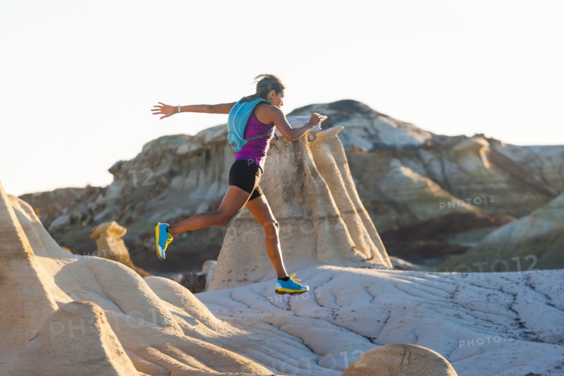 Native American woman running in desert
