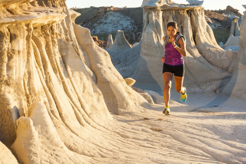 Native American woman running in desert