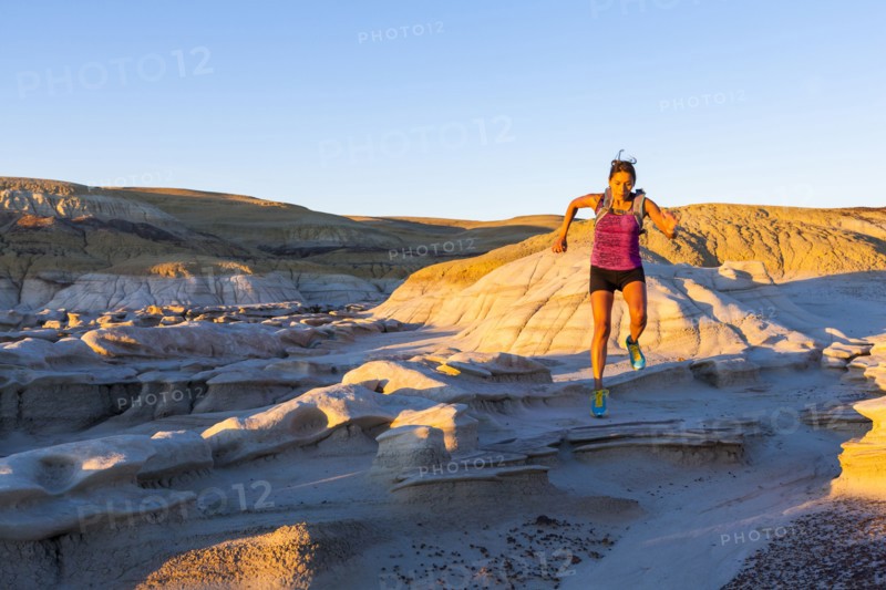 Native American woman running in desert