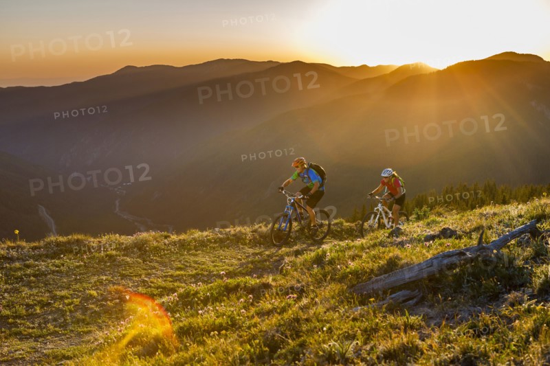 Caucasian couple mountain biking