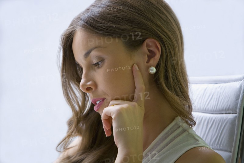 Mixed race businesswoman working at desk