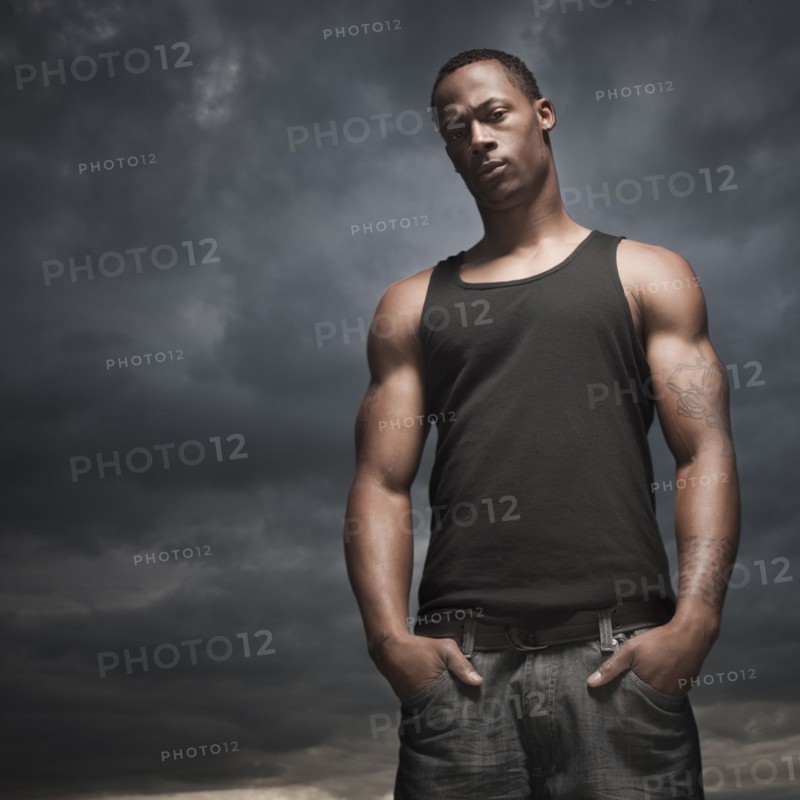 African man with hands in pockets