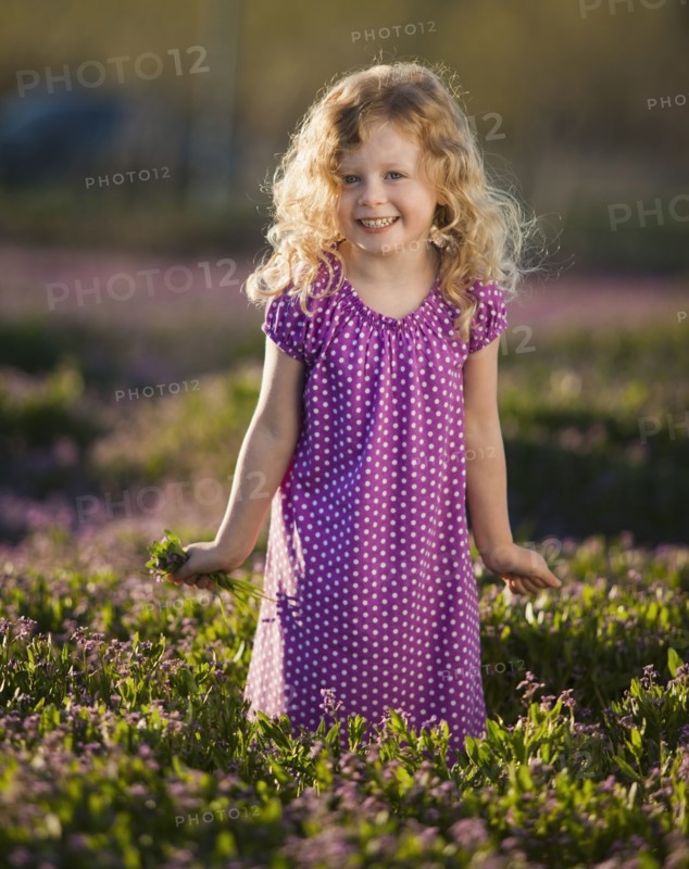 Caucasian girl picking flowers