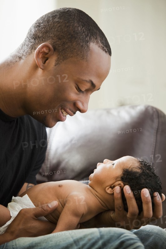 Father holding newborn baby