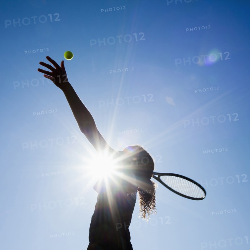 Caucasian woman playing tennis