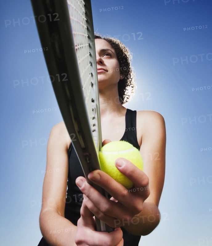 Caucasian woman playing tennis