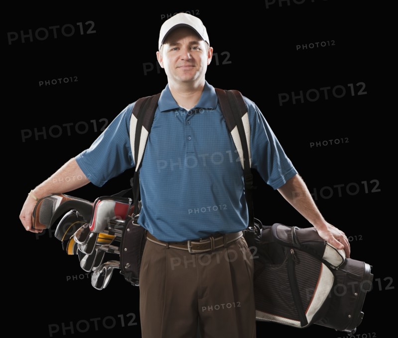 Caucasian golfer carrying golf bag