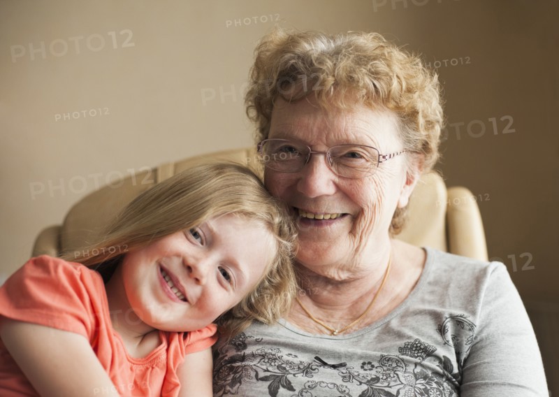 Smiling Caucasian grandmother and granddaughter
