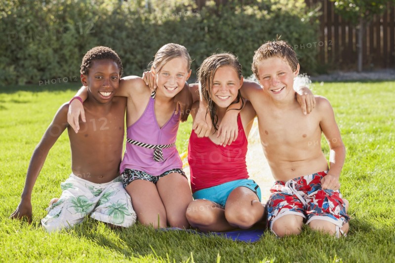 Friends hanging out together in yard
