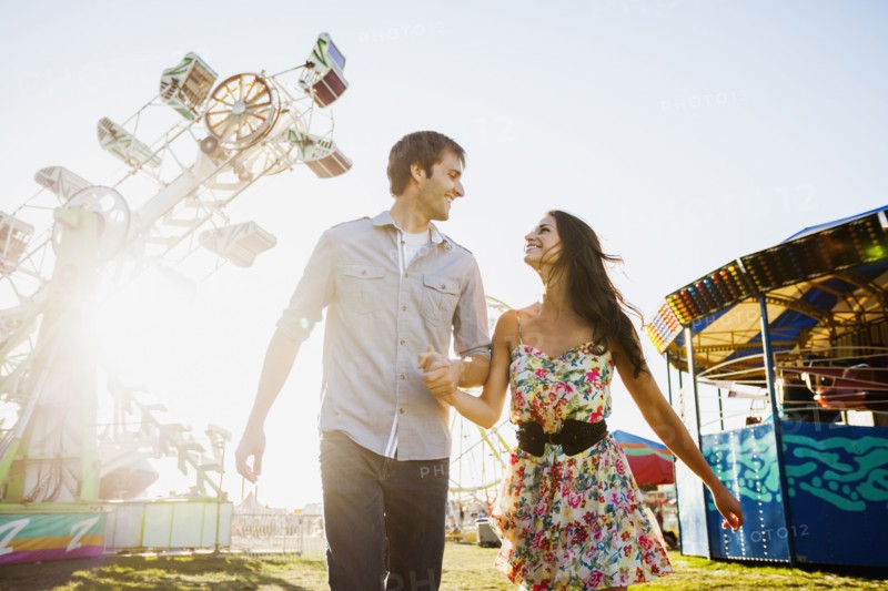 Caucasian couple enjoying carnival
