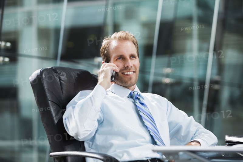 Caucasian businessman talking on cell phone