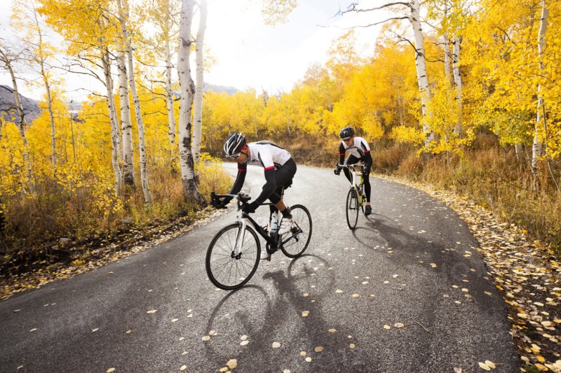 Caucasian cyclists on rural road