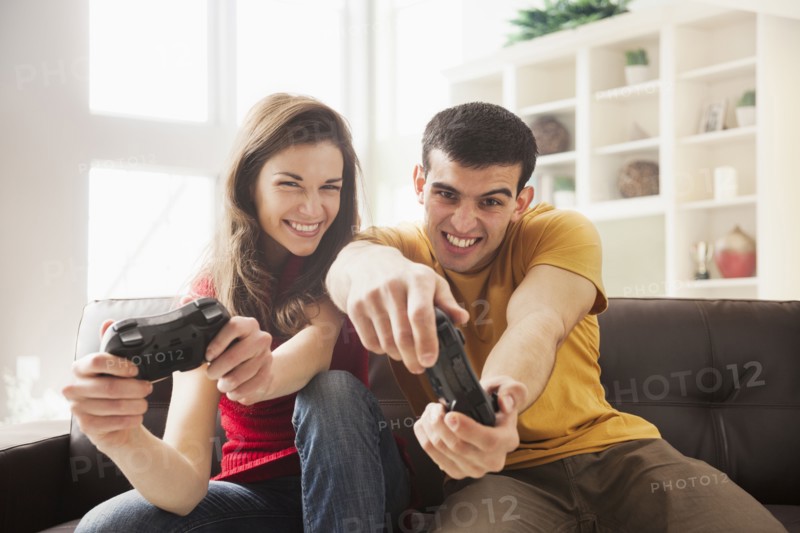 Couple playing video games together