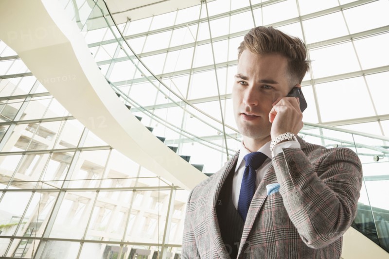 Caucasian businessman talking on cell phone
