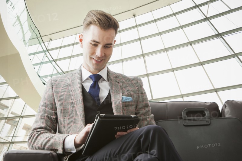 Caucasian businessman using digital tablet