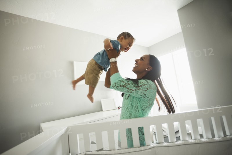 Mother playing with baby boy