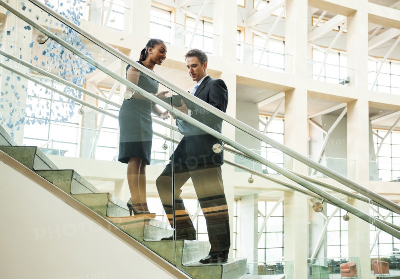 Business people talking on staircase