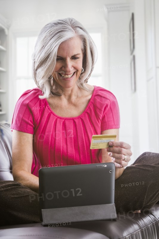 Smiling Caucasian woman shopping online