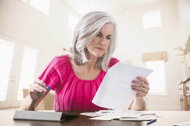 Caucasian woman paying bills online