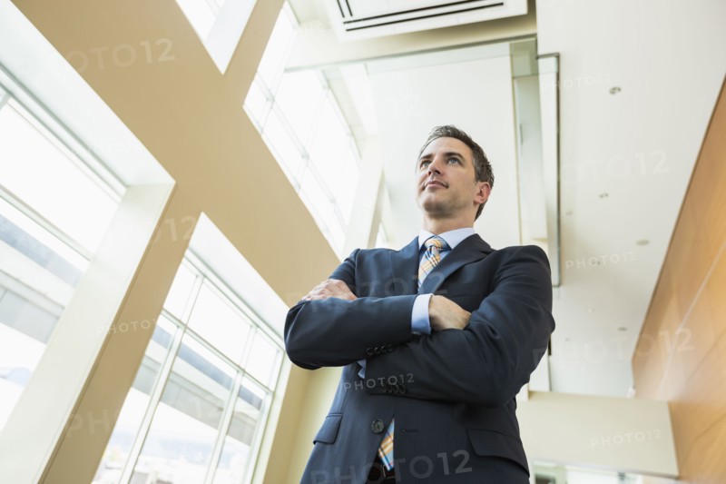 Low angle view of Caucasian businessman standing in office