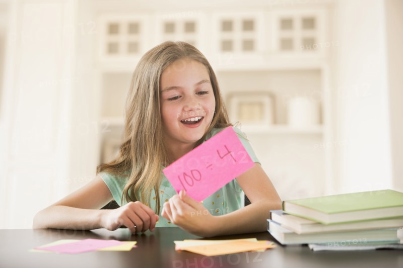 Caucasian girl studying with flash cards